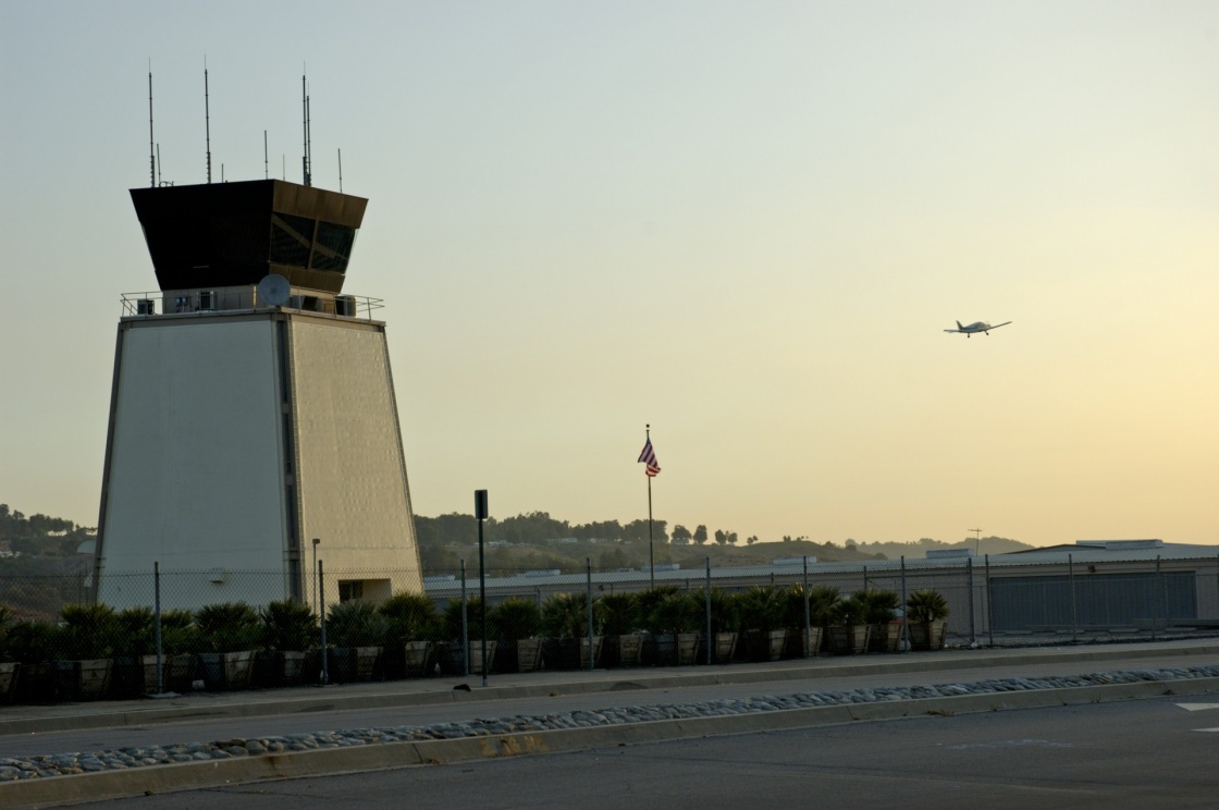 'Airport traffic control tower at sunset with small airplane taking off' - Gran Canaria Island